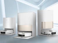 Trois aspirateurs robots Dreame dans un cadre moderne et minimaliste.