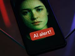 Un smartphone affichant un visage avec un motif de grille verte et un message 'Alerte IA!'.