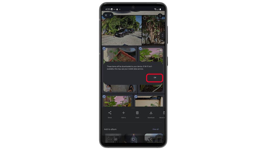 Appuyez sur Continuer pour confirmer le téléchargement groupé dans Google Photos.